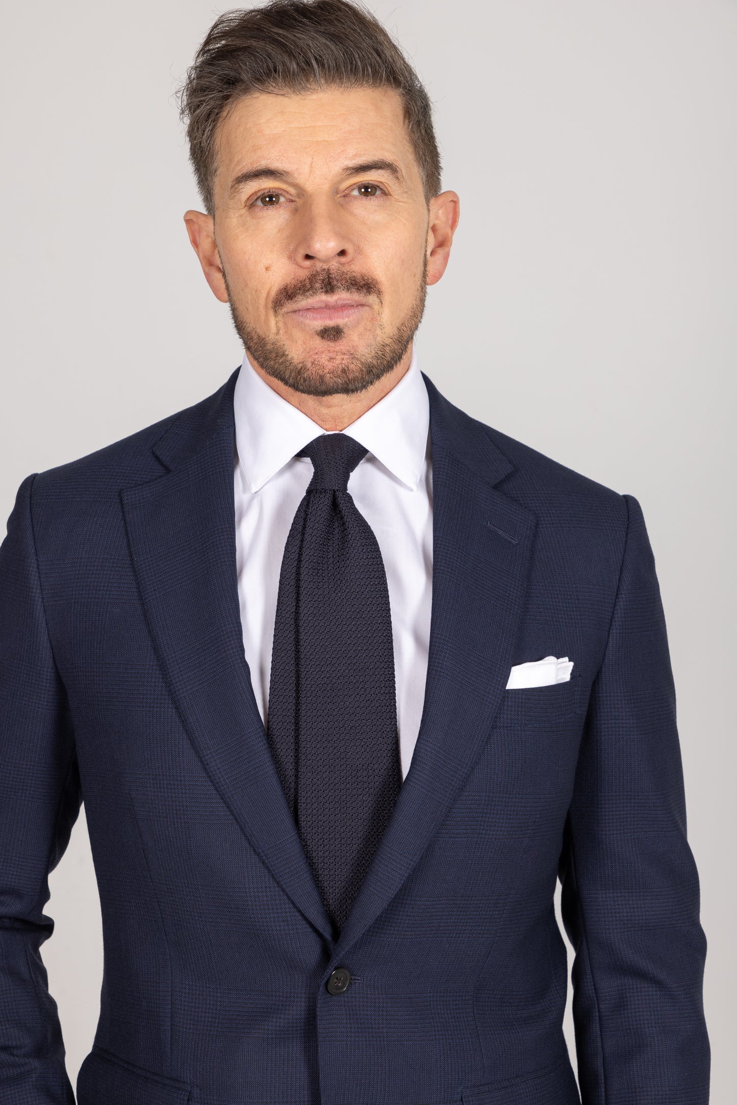 
                  
                    Single Breasted Notch Suit in Navy Glen Check Wool
                  
                