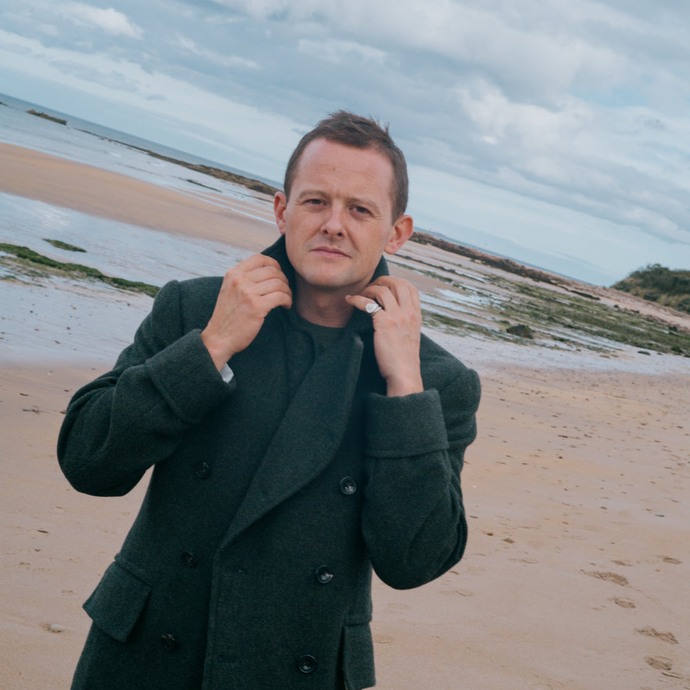 
                  
                    Knitted T-Shirt in Moss Merino Wool
                  
                